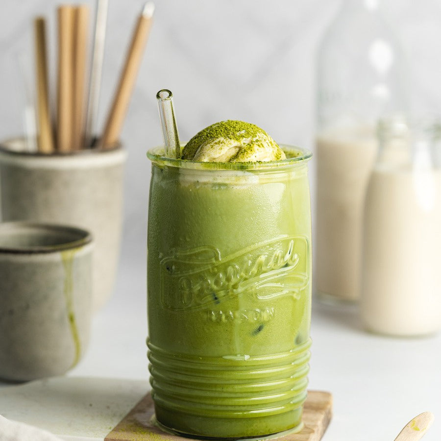 Whisked organic matcha tea in a cup – natural energy boost and focus-enhancing superfood.